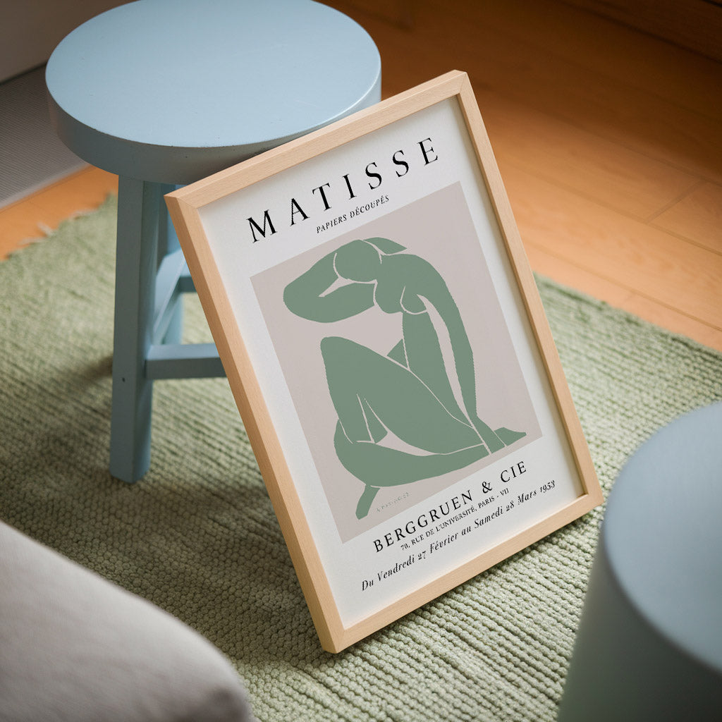 A sage green adaptation of Henri Matisse’s iconic Blue Nude, featuring a minimalist cut-out figure in a seated pose.