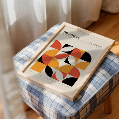 Geometric Bauhaus art poster with bold orange, red, and black shapes, inspired by the Bauhaus Weimar Exhibition 1923. Perfect for modern and minimalist interiors such as living rooms or offices. Makes a thoughtful gift for fans of mid-century modern design and Bauhaus art.