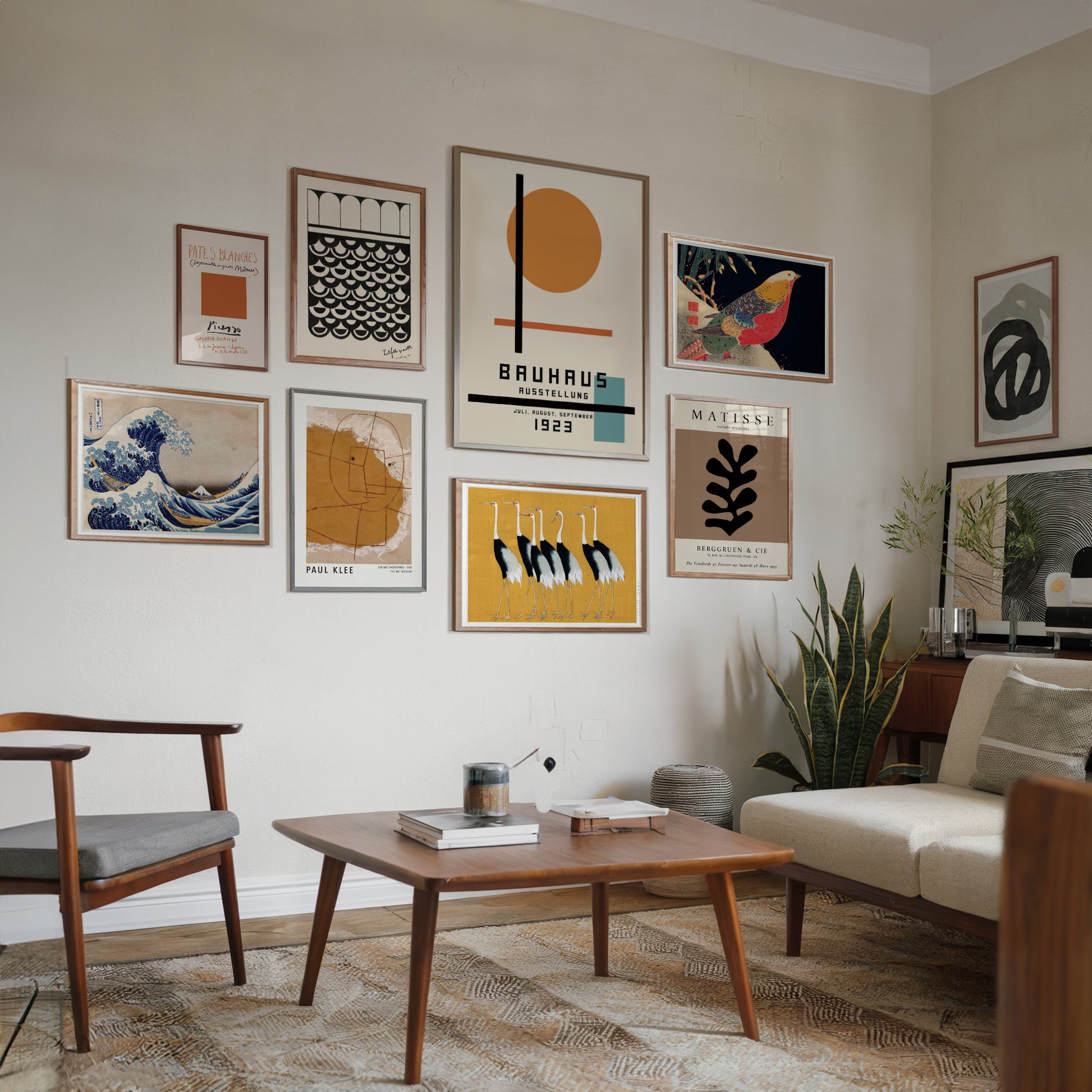 A set of 8 art posters arranged on a gallery wall, featuring pieces from Bauhaus, Picasso, Matisse, Paul Klee, Hokusai, Ogata Korin, and Ito Jakuchu. The collection showcases a harmonious blend of modernist design and classic Japanese woodblock prints.