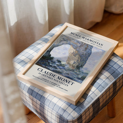 Exhibition poster of Claude Monet’s The Manneport, Rock Arch West of Etretat (1883), depicting the stunning coastal arch in Impressionist style with dynamic waves. A beautiful art print gift for lovers of Monet and coastal landscapes.