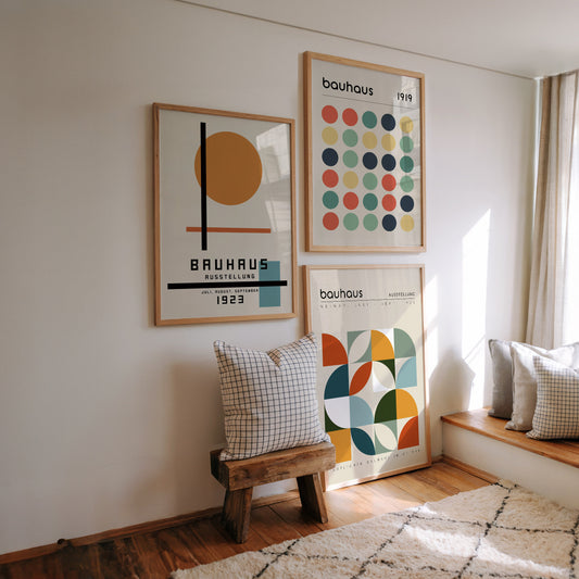 Set of three Bauhaus-inspired posters featuring geometric designs in a minimalist, retro color palette. Perfect for adding mid century modern, artistic flair to home or office walls and an excellent gift for design enthusiasts.