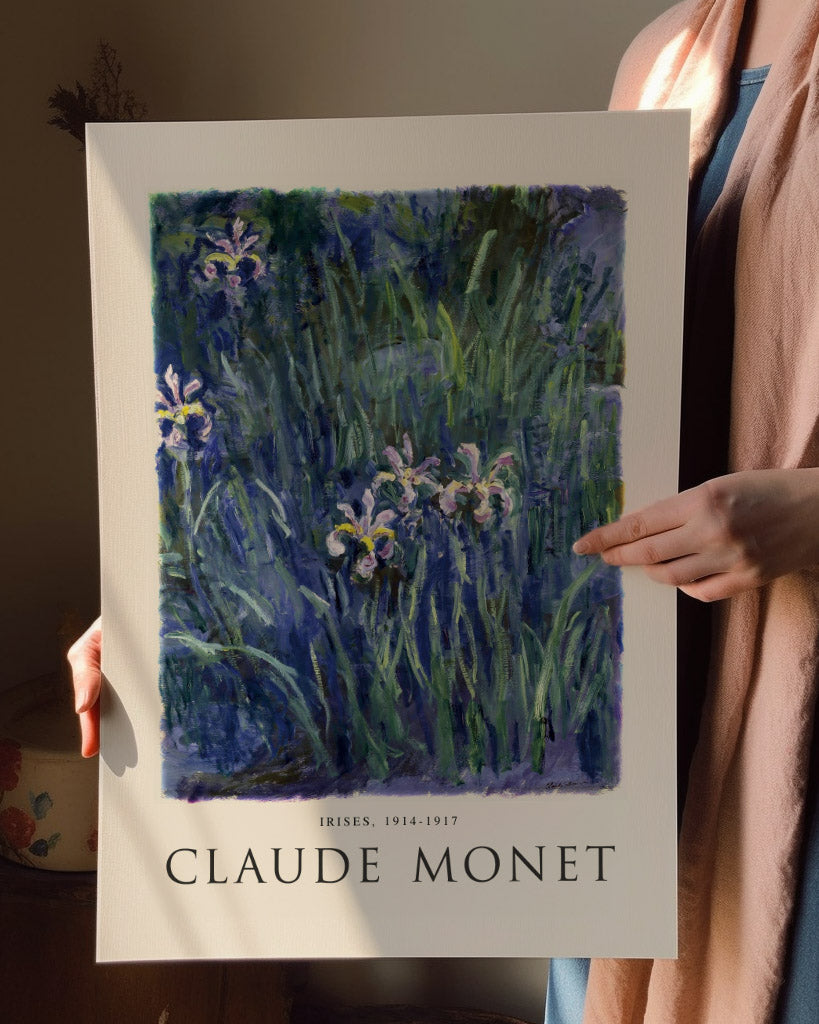 Impressionist art print of Claude Monet’s Irises, depicting vibrant purple irises among lush green foliage with soft brush strokes and light interplay. Perfect for adding a classic touch to modern decor.