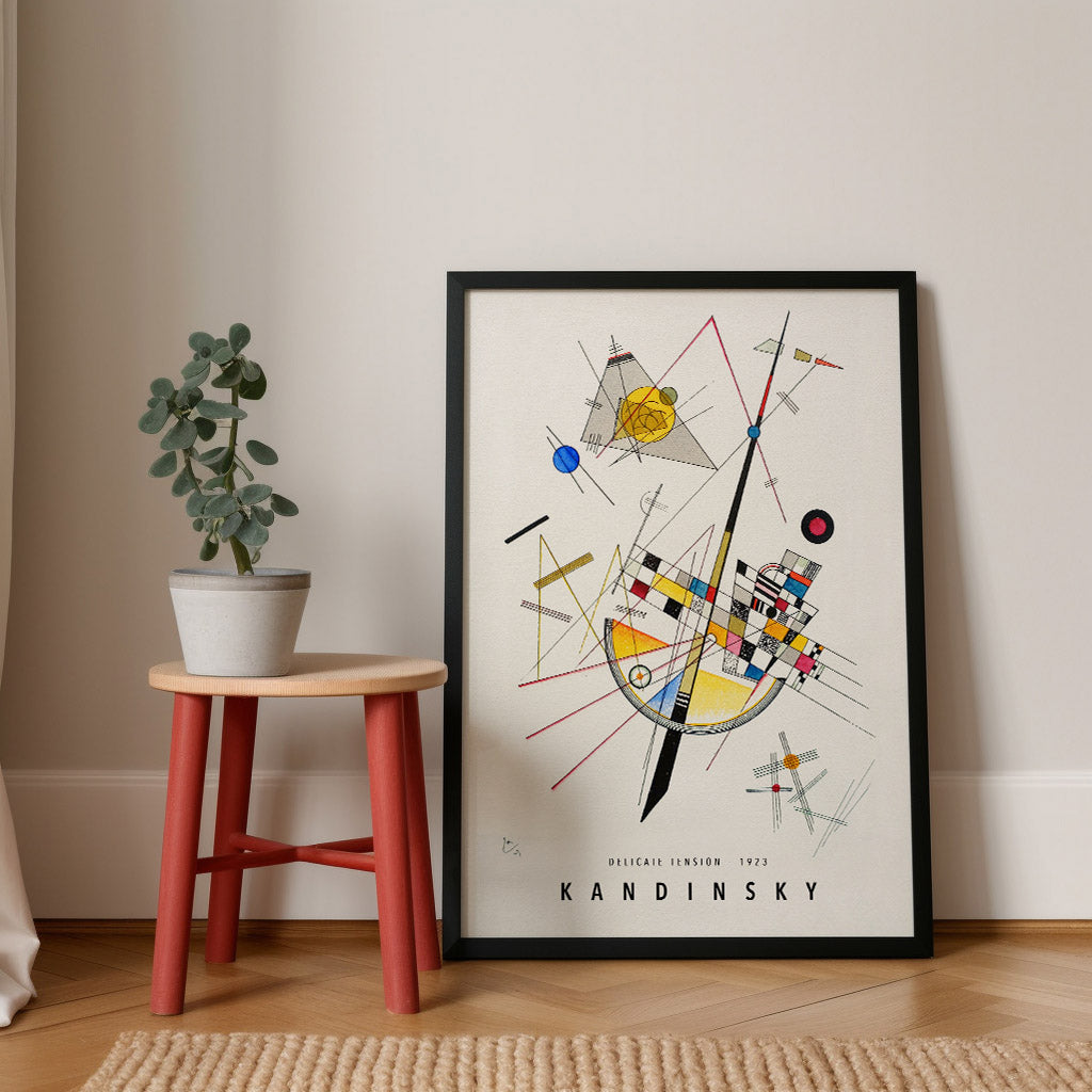 Art print of Wassily Kandinsky’s Delicate Tension from 1923, showcasing a composition of bold geometric shapes and intersecting lines in colors like yellow, red, and blue on a white background.