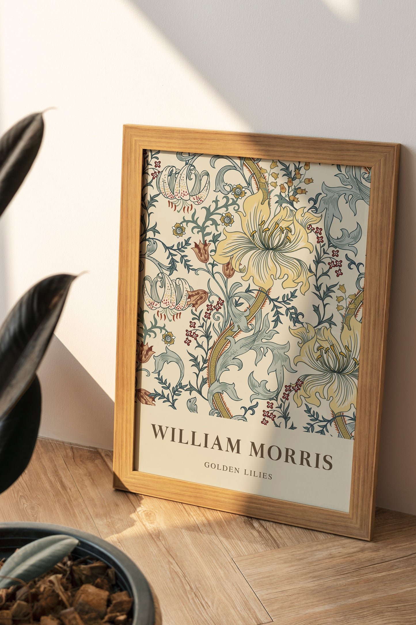 William Morris’s “Golden Lilies” poster featuring an intricate floral design with soft yellow lilies and Victorian motifs on a light background, bringing a touch of timeless elegance to any decor.